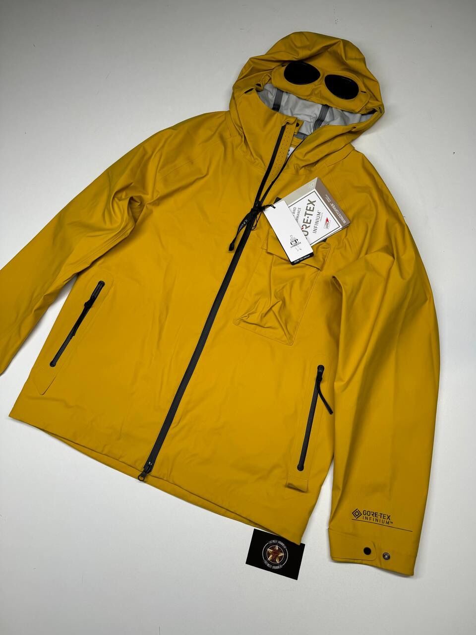 img_9025 CP Company 186A Gore-Tex Infinium Waterproof Goggle Jacket in Nugget Gold - Image 1