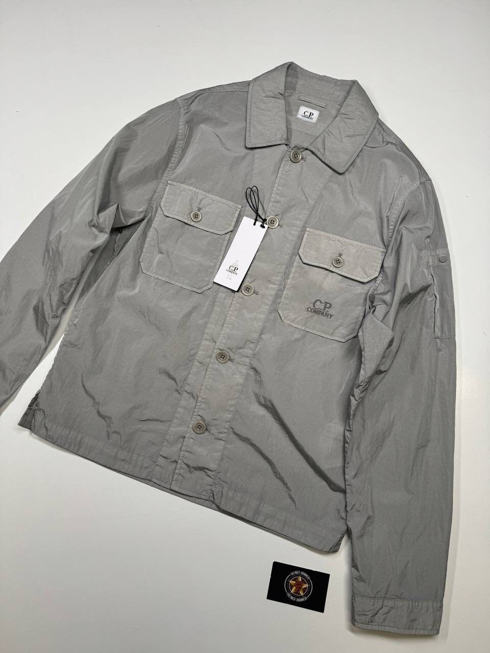 713484316_925361580592153_4419225171282486012_n C.P. COMPANY 106A Chrome-R Overshirt in silver grey - Image 1