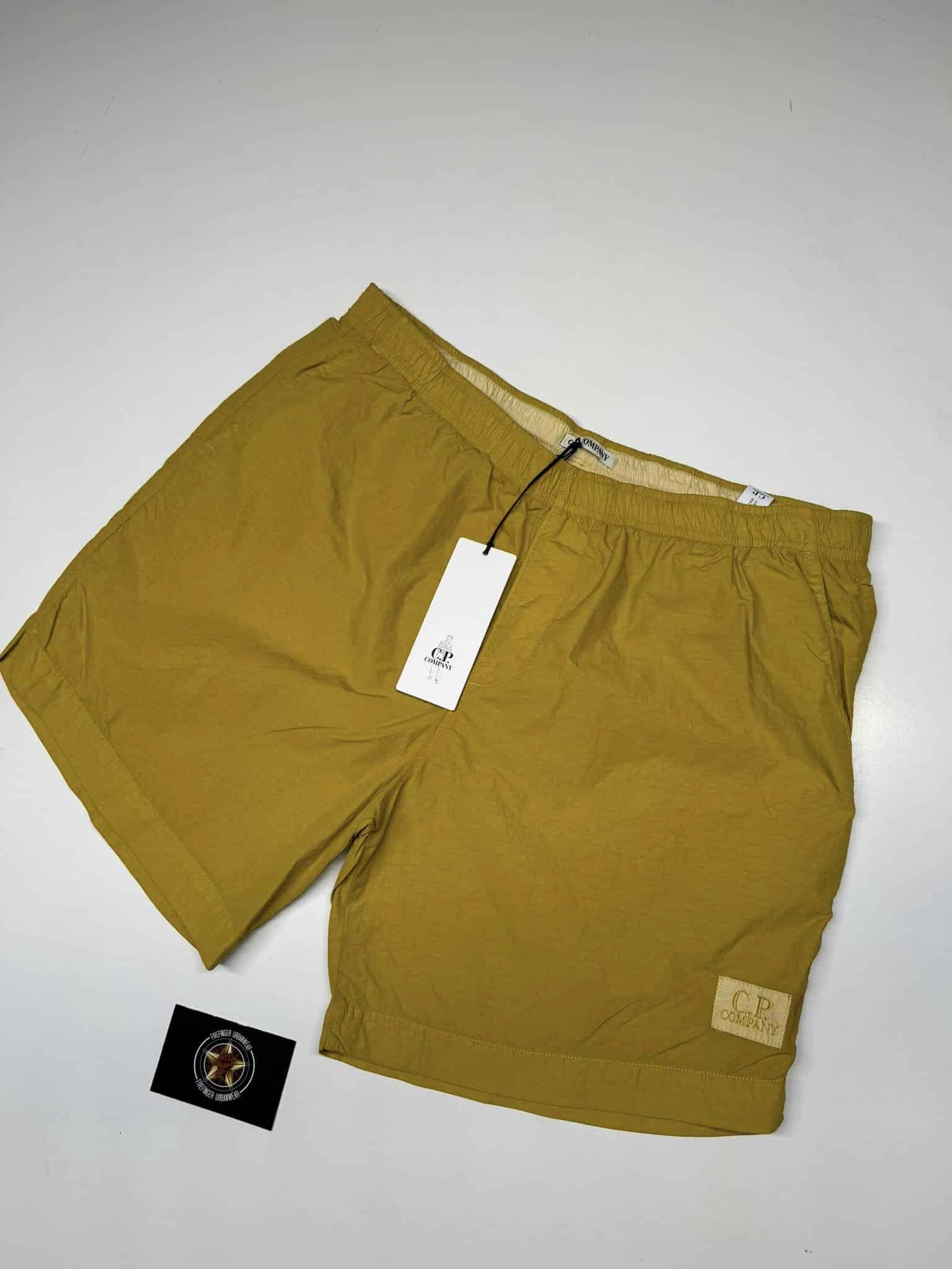 385840244_186922141102771_8448631785915610865_n CP Company Mens Flatt nylon boxer swim shorts in Golden Yellow. - Image 1
