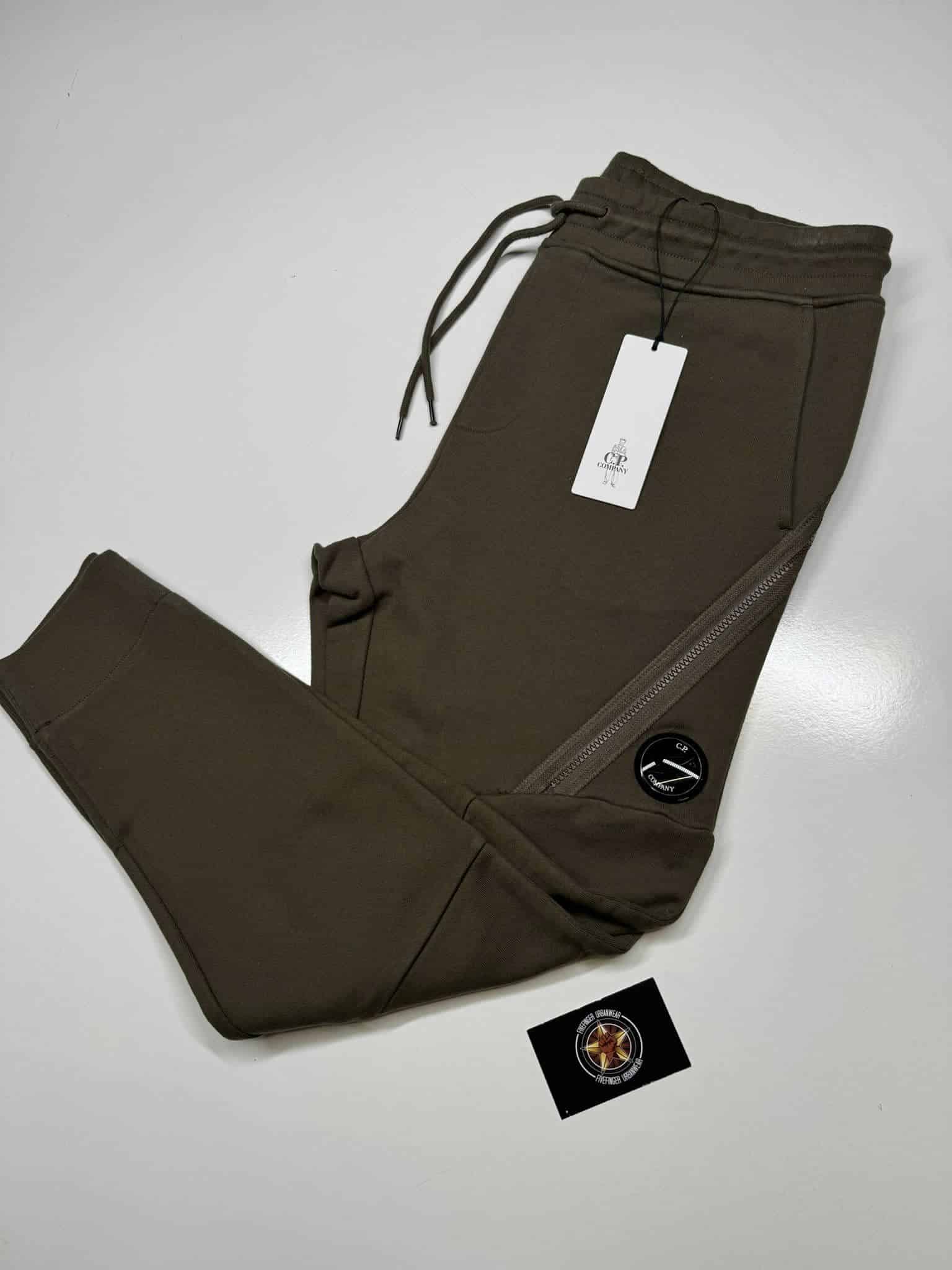 CP Company Diagonal Raised Fleece Lens Pocket Sweatpants in Dark Green. - Image 1