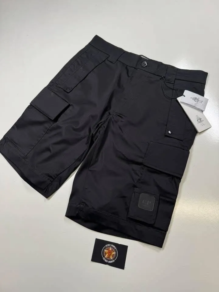C.P COMPANY METROPOLIS SATIN STRETCH CARGO SHORTS IN BLACK  -      Size 44” /  w30” - w31” - Image 1