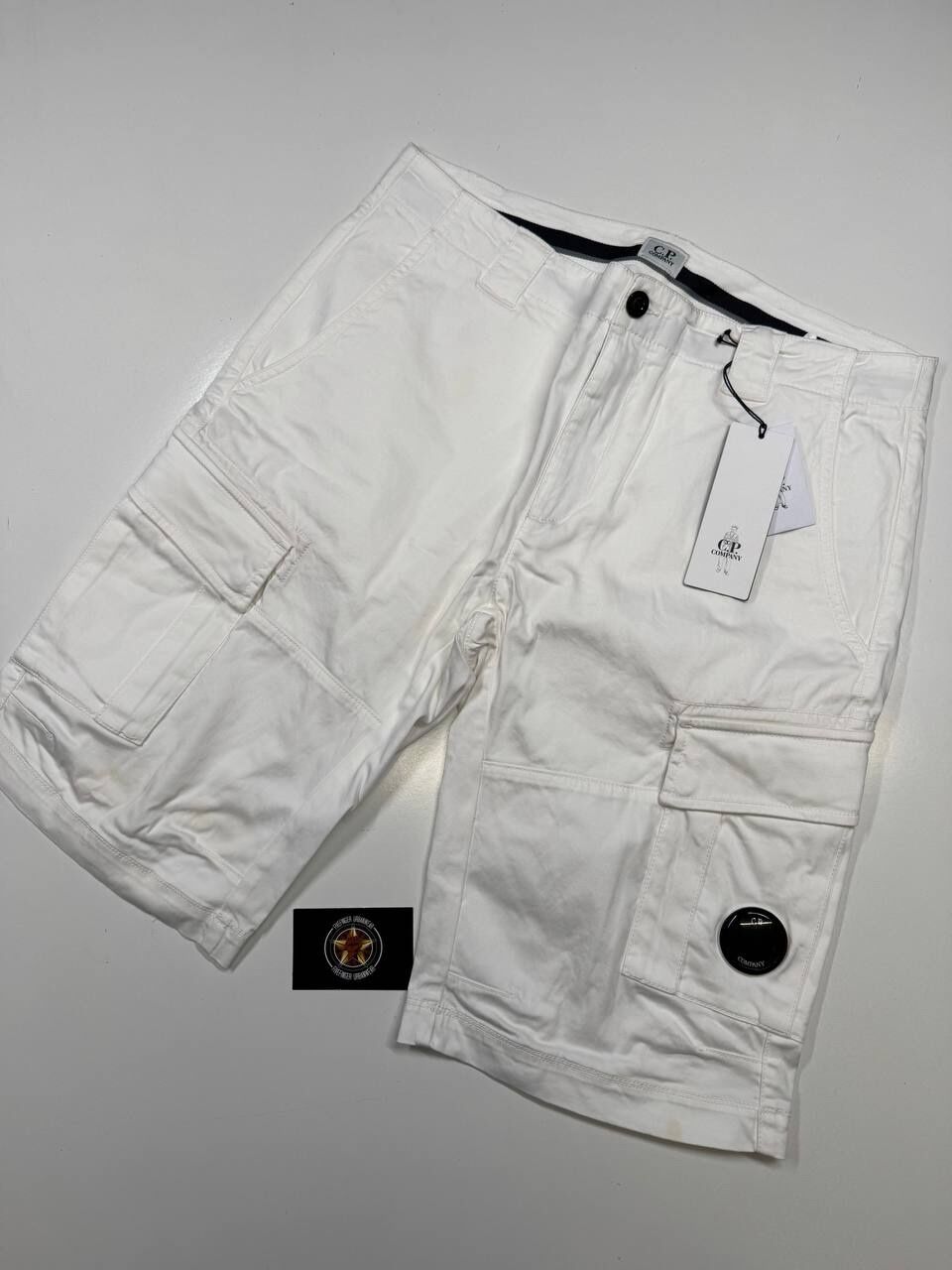 C.P COMPANY 116A SATIN STRETCH CARGO SHORTS IN WHITE - Image 1