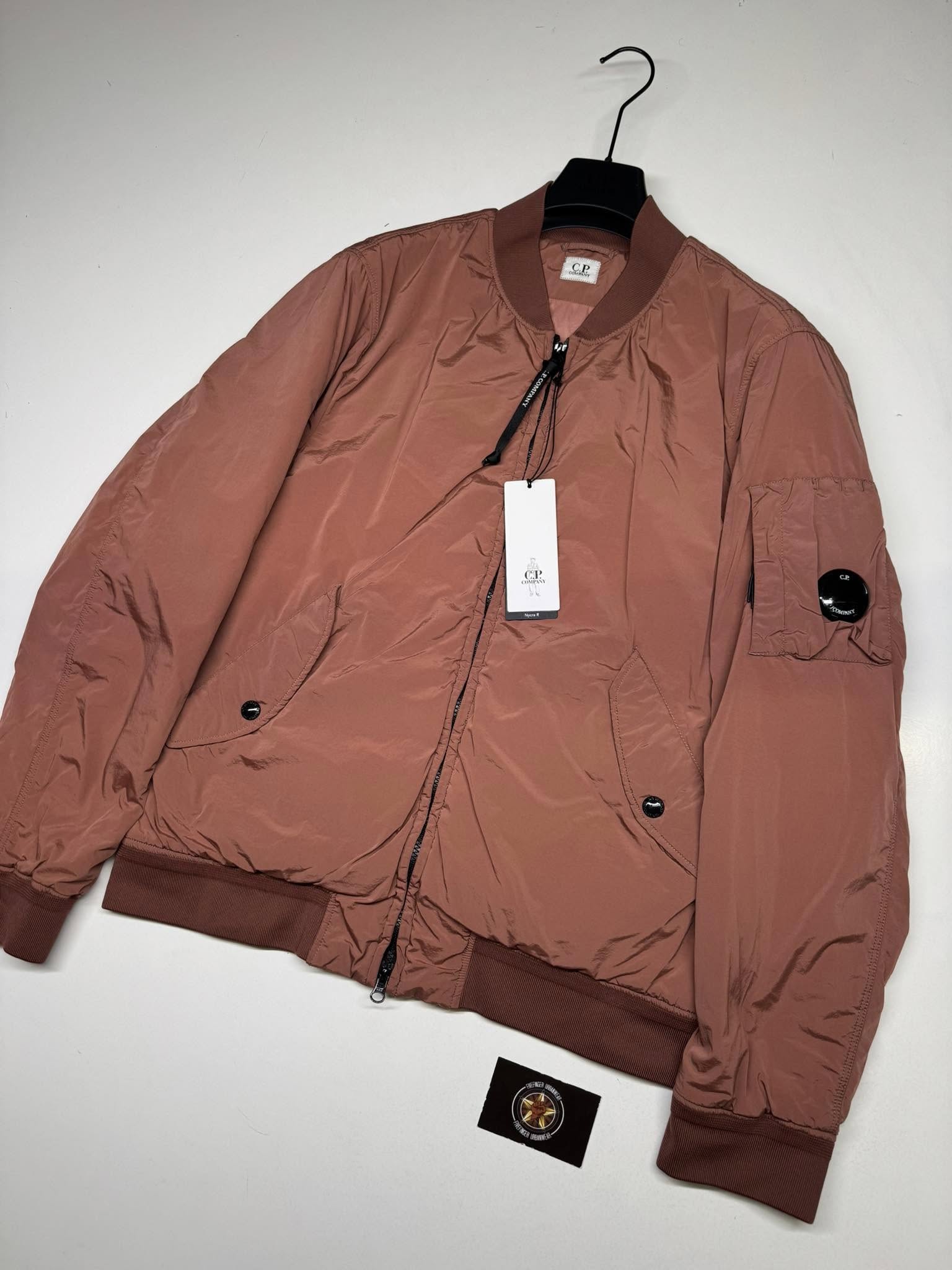 486855140_569989149462733_2759426959185063622_n C.P. COMPANY 249A NYCRA-R PADDED BOMBER JACKET IN PASTEL ROUGE. - Image 1