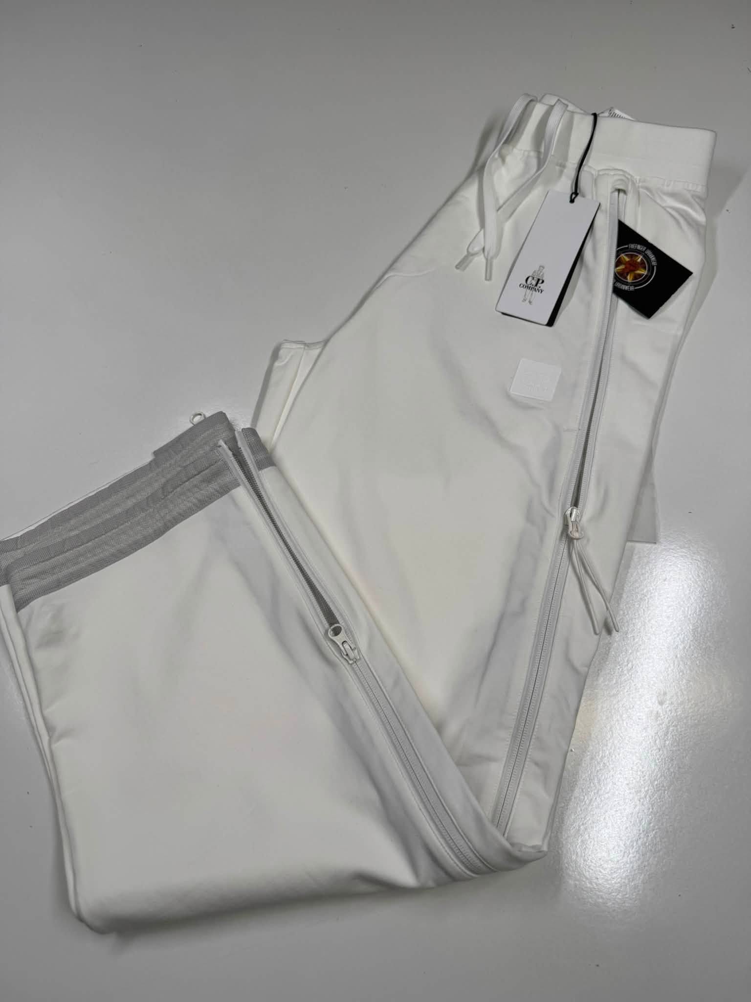 CP COMPANY METROPOLIS 021A STRETCH FLEECE MIXED JOGGING PANTS IN WHITE - Image 1