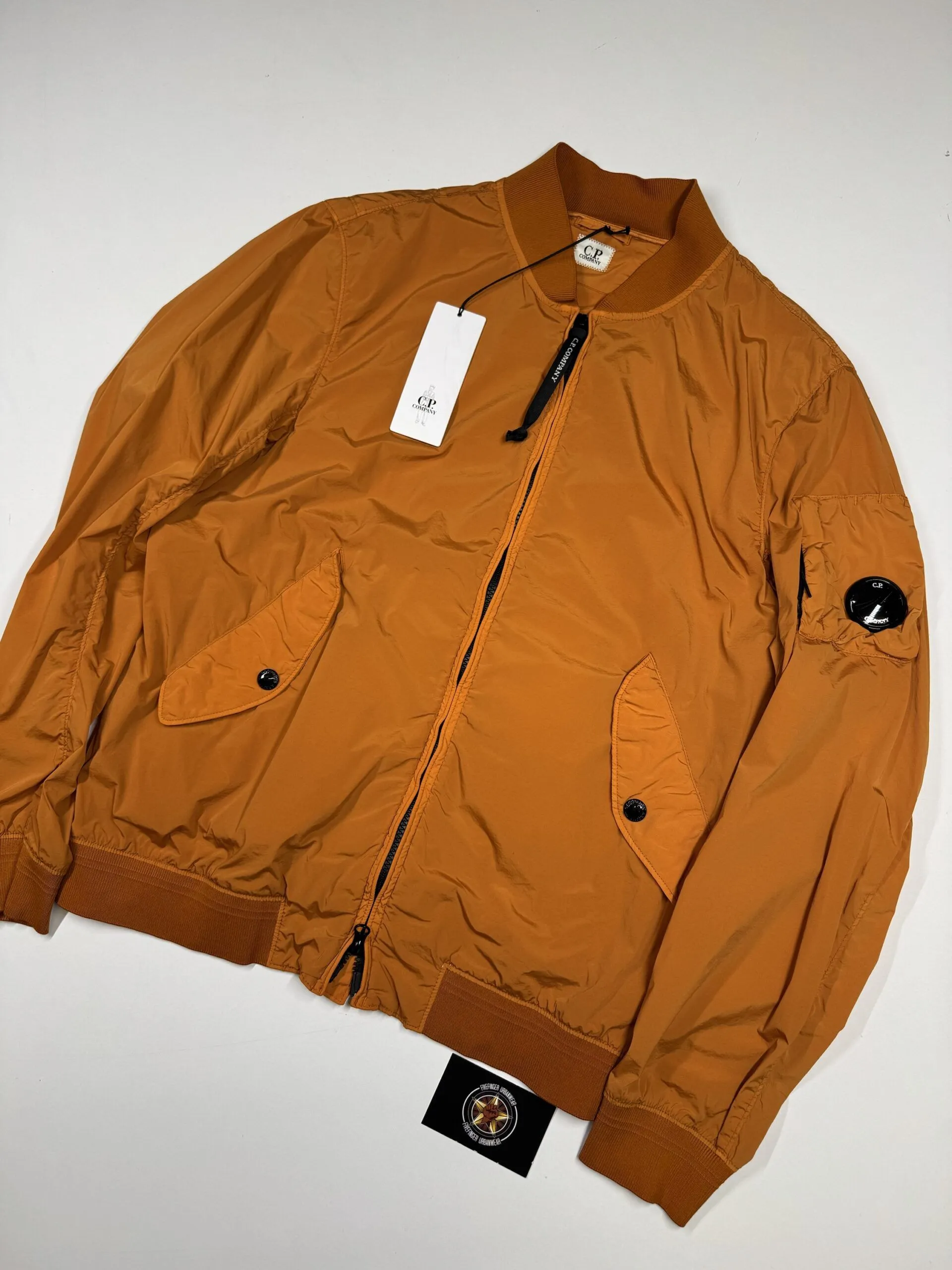 C.P. COMPANY 004A NYCRA-R BOMBER JACKET IN ORANGE  -  Large / P2P 22” - Image 1