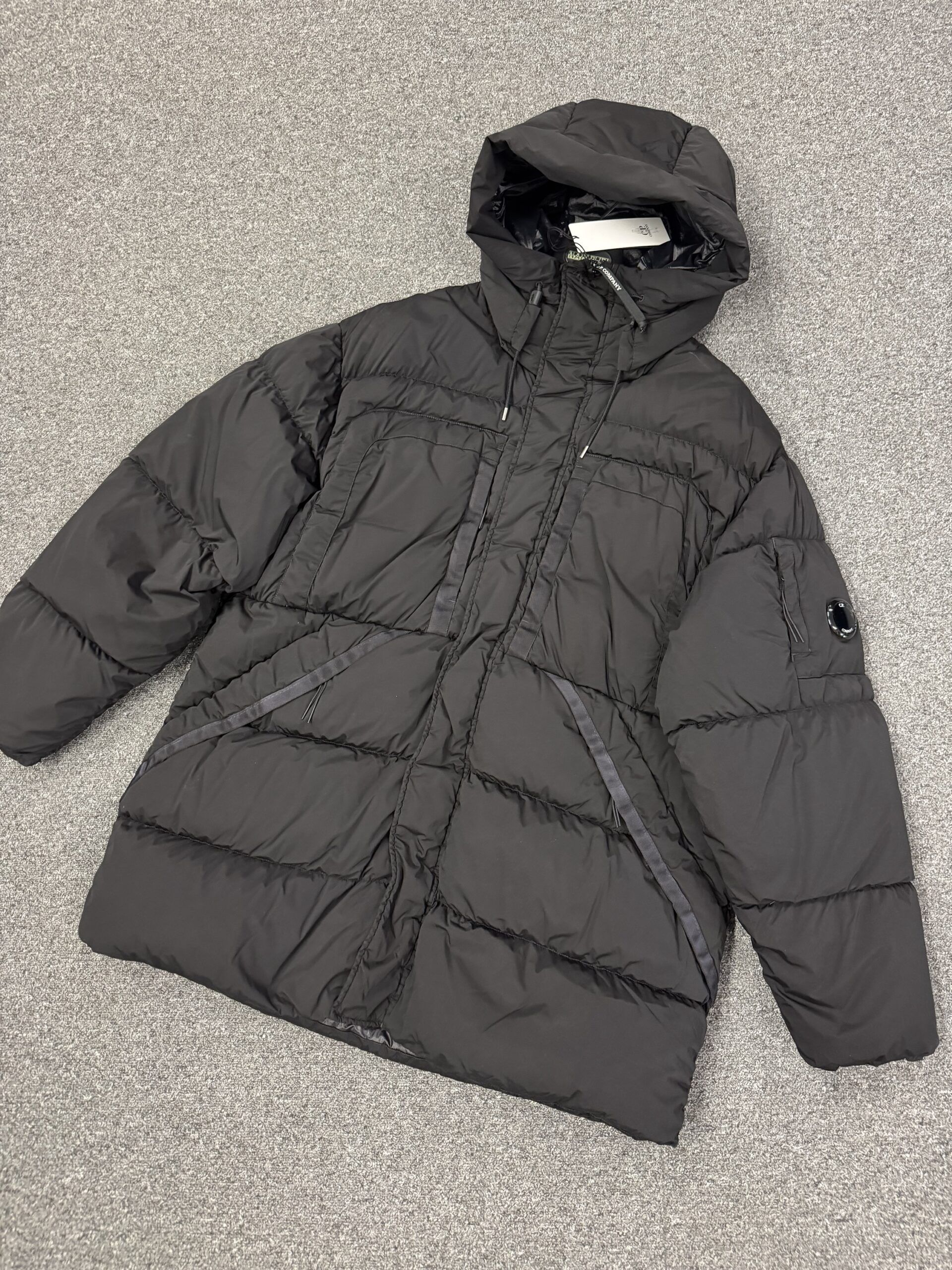 C.P. COMPANY 173A GARMENT DYED 'NYCRA-R”DOWN LENS HOODED JACKET IN BLACK    -   XL / P2P  26” - Image 1