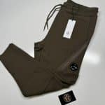 CP Company Diagonal Raised Fleece Lens Pocket Sweatpants in Dark Green.