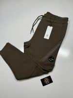 CP Company Diagonal Raised Fleece Lens Pocket Sweatpants in Dark Green.