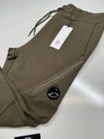 CP Company Diagonal Raised Fleece Lens Pocket Sweatpants in Dark Green. - Image 2