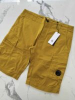 C.P. Company Satin Stretch Cargo Shorts in Golden yellow