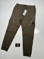 CP Company Diagonal Raised Fleece Lens Pocket Sweatpants in Dark Green. - Image 4