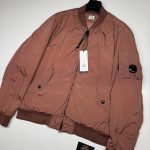 C.P. COMPANY 249A NYCRA-R PADDED BOMBER JACKET IN PASTEL ROUGE.