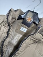 CP COMPANY NYCRA-R DOWN JACKET IN VINTAGE KHAKI  - Large / 24” P2P - Image 4