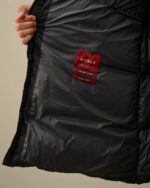 CP COMPANY 202A LENS BUTTON NYCRA-R LONG JACKET IN BLACK SAND  - Large / 25” P2P - Image 11