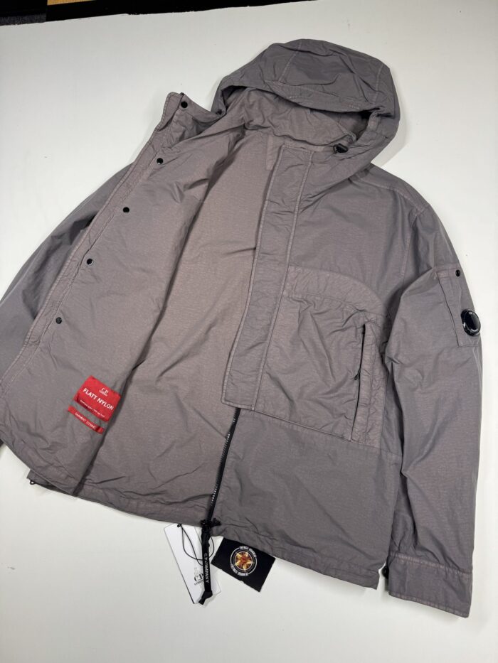 CP COMPANY 132A FLATT NYLON HOODED LENS OVERSHIRT IN BOULEVARD
