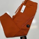 CP COMPANY 084A DIAGONAL RAISED FLEECE JOGGING PANTS IN PUMPKIN ORANGE / 438