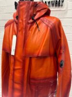 CP COMPANY 129A BI-FILM PARKA LENS JACKET IN PUMPKIN ORANGE - Image 7