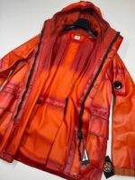 CP COMPANY 129A BI-FILM PARKA LENS JACKET IN PUMPKIN ORANGE - Image 6