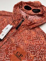 CP Company 278A Inca Print Short Goggle Jacket in Orange - Image 3