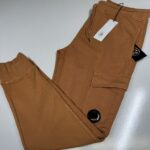CP Company 100A Cotton  Diagonal Fleece Lens pocket sweatpants in orange