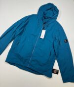 Cp Company 014A Flatt Nylon Reversible Hooded Lens Jacket in blue