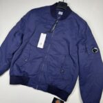AW26/27   C.P. COMPANY 081A T-FLATT NYLON PADDED BOMBER JACKET IN NAVY  - Large / P2P  23.5”
