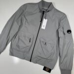 CP COMPANY 010A PRO-TEK LENS JACKET IN GREY  -     Size 52 / XL / p2p 24”