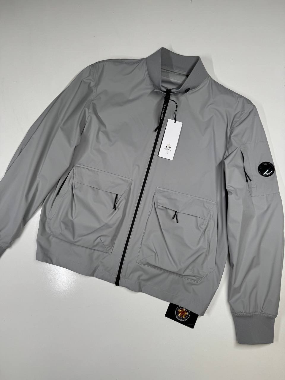img_9532-2 CP COMPANY 010A PRO-TEK LENS JACKET IN GREY - Size 52 / XL / p2p 24” - Image 1
