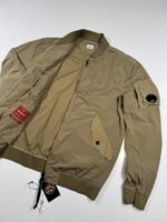 C.P. COMPANY 182A  NYCRA-R BOMBER JACKET IN VINTAGE KHAKI - Image 7