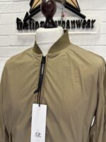 C.P. COMPANY 182A  NYCRA-R BOMBER JACKET IN VINTAGE KHAKI - Image 9