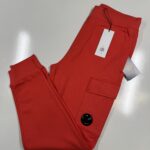 CP COMPANY 017A DIAGONAL RAISED FLEECE JOGGING PANTS IN CORAL  / 547  -   Medium / w32”.