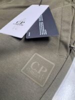 CP COMPANY METROPOLIS 034A STRETCH FLEECE MIXED JOGGING PANTS IN GREEN  • Medium / W32” - Image 2